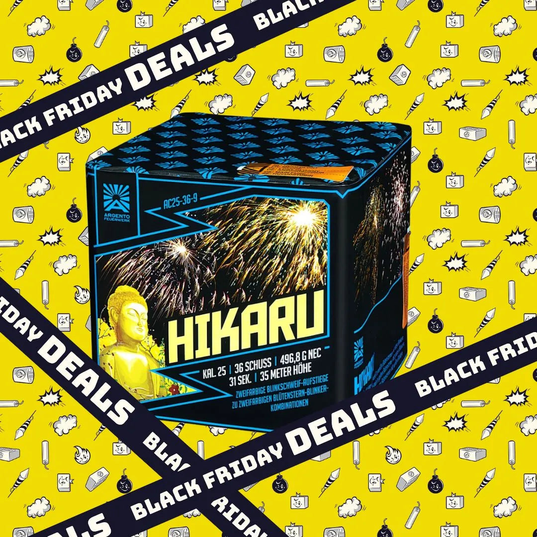Eine Argento Hikaru Feuerwerksbatterie-Box, die Buddha und Feuerwerk mit Blütenstern-Effekt zeigt, steht auf einem gelben Hintergrund mit Cartoon-Symbolen und schwarzen "Black Friday Deals"-Bannern.